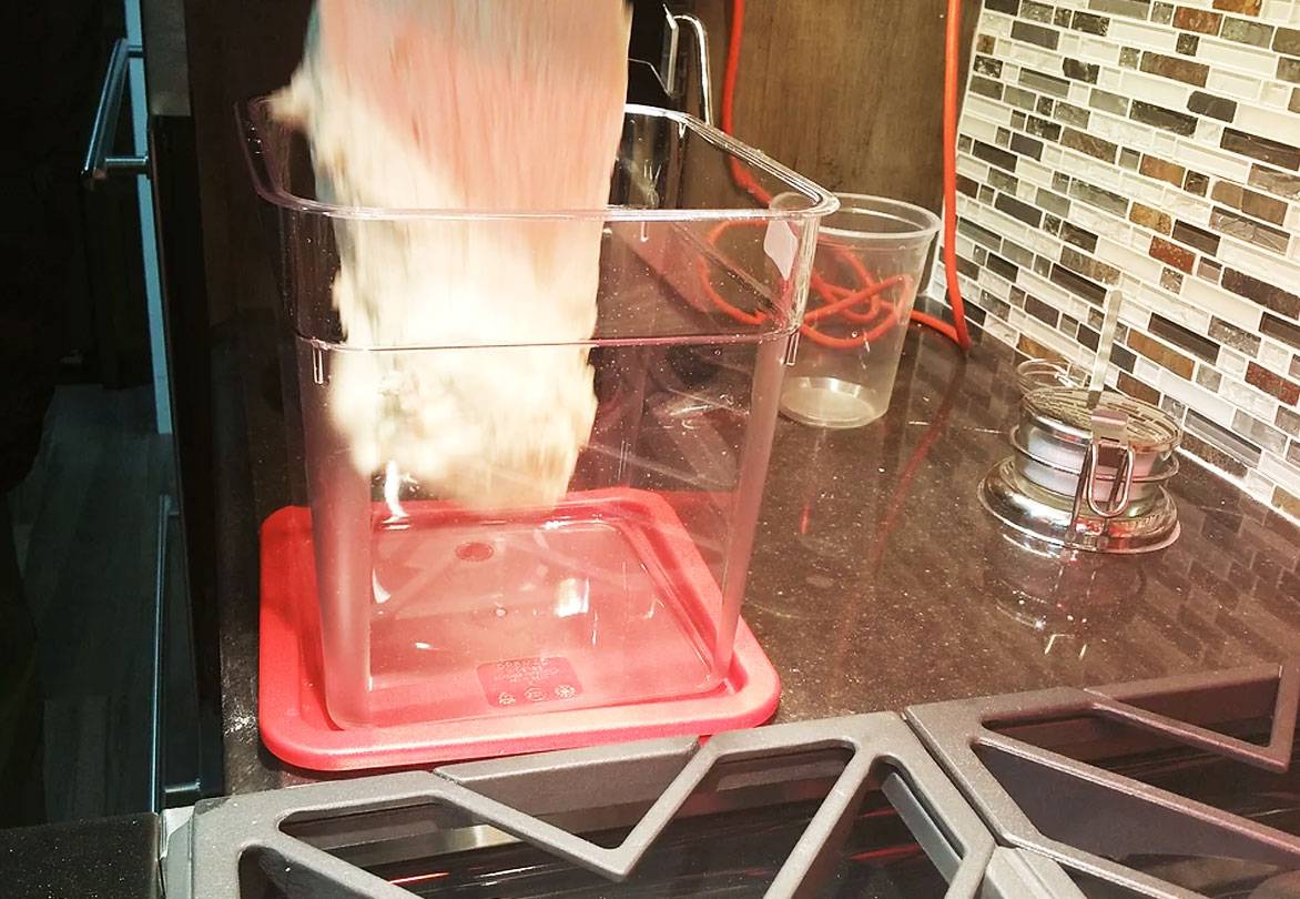 pouring dough into container