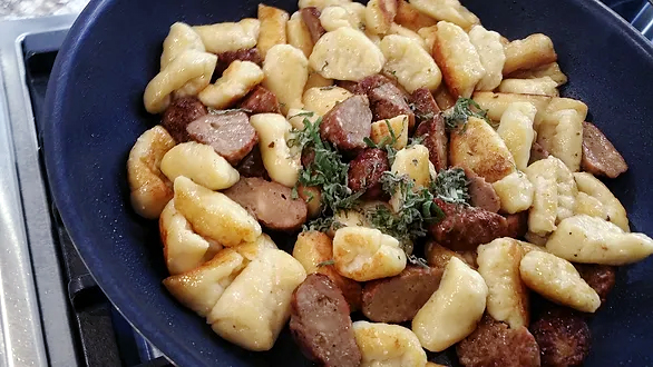 Adding sausage into gnocchi