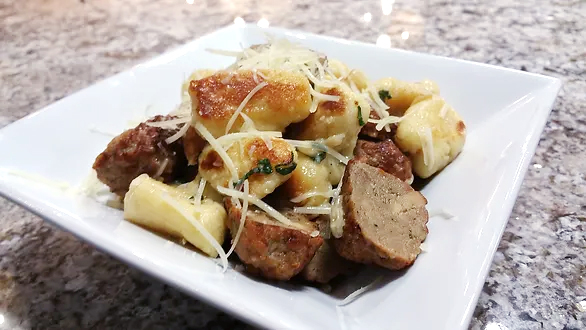 Gnocchi served on nice plate.